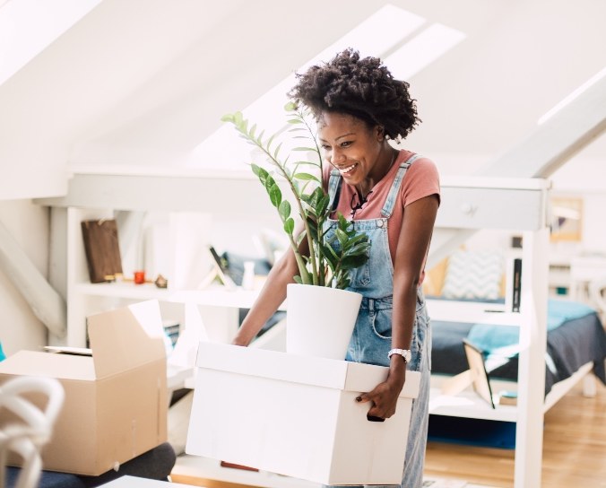 A woman in Edmonton is moving plants and furniture to her new home